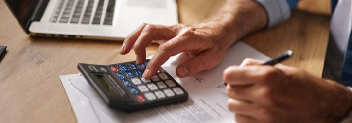 A person using a calculator